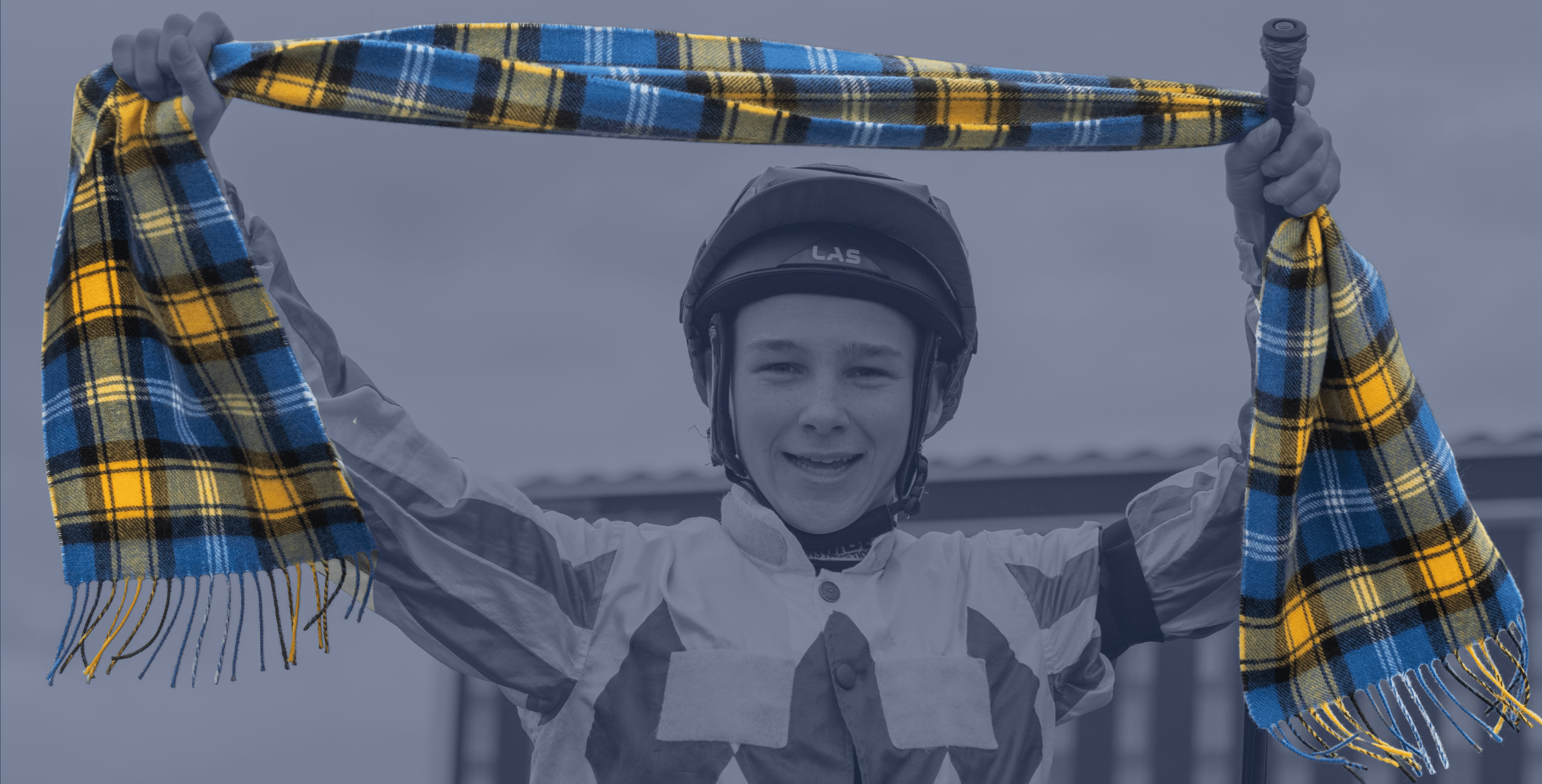 Jockey holding the Doddie tartan scarf